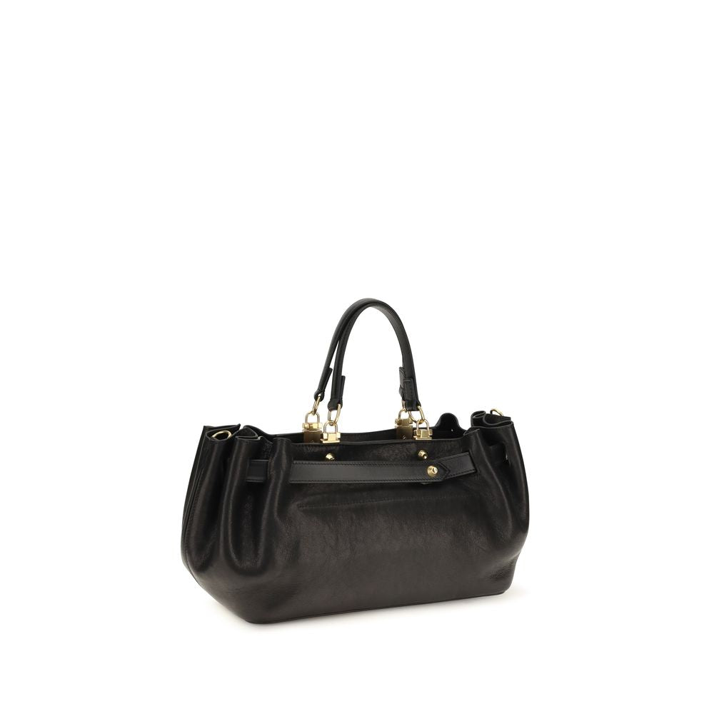 Indulge in the exquisite allure of the Balenciaga Black Calf Leather Bos Taurus Shoulder Bag, a masterpiece of Italian craftsmanship that elevates your style with its luxurious silhouette and timeless elegance.