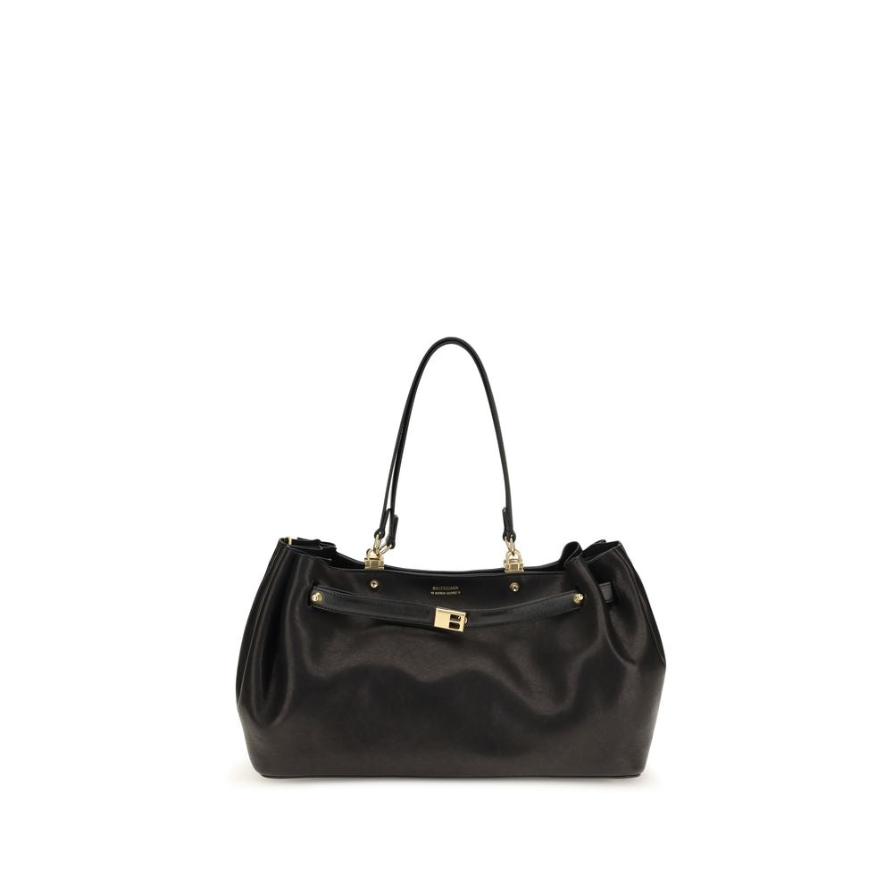 Indulge in the elegance of the Balenciaga Black Calf Leather Bos Taurus Shoulder Bag, a masterpiece of Italian craftsmanship that embodies timeless luxury and sophistication.