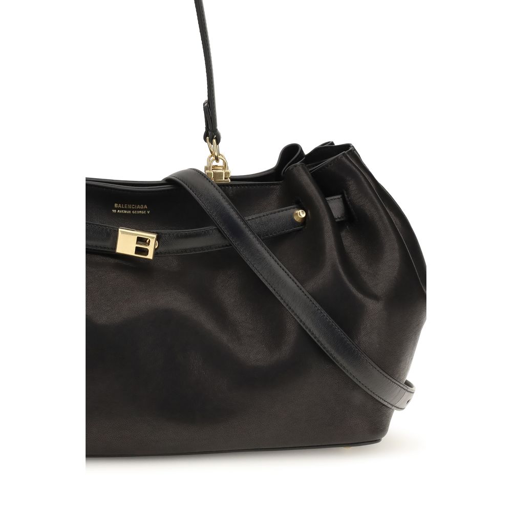 Indulge in the exquisite craftsmanship of the Balenciaga Black Calf Leather Bos Taurus Shoulder Bag, a timeless piece that embodies luxury and sophistication for the discerning individual.