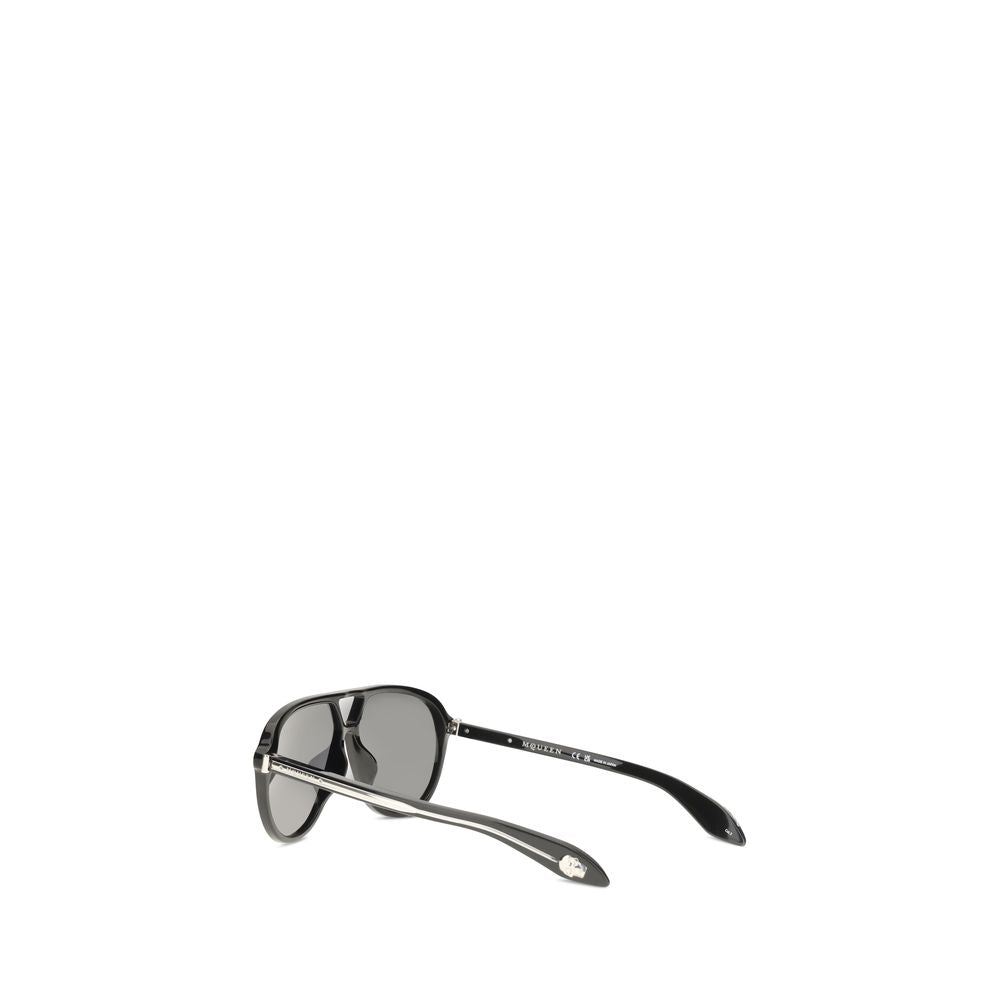 Discover the allure of Alexander McQueen's Black Acetate Sunglasses, where bold design meets exquisite Italian craftsmanship, perfect for the discerning connoisseur.