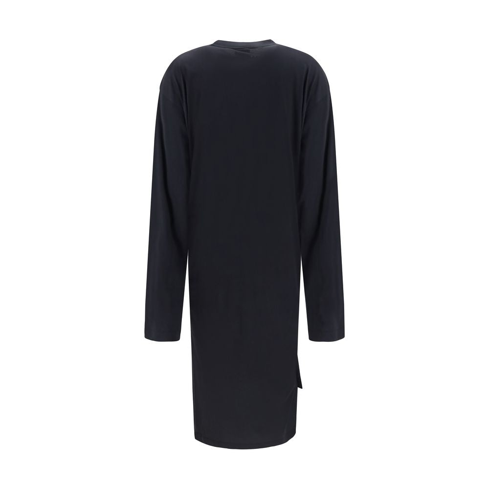 Indulge in the exquisite Balenciaga Black Cotton Casual Dress, a masterpiece of soft cotton that embodies fluid elegance and sophisticated allure for the discerning individual.