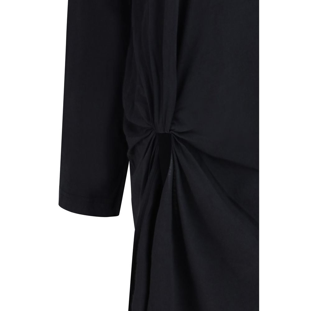 Elevate your wardrobe with the Balenciaga Black Cotton Casual Dress, a masterpiece of soft cotton that embodies fluid elegance and sophisticated allure for any occasion.