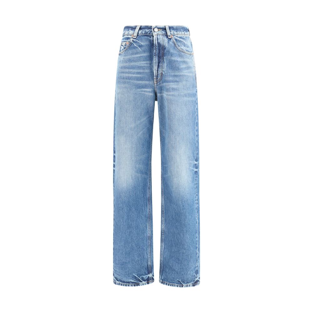 Indulge in the exquisite allure of Saint Laurent's Blue Cotton Relaxed Fit Jeans, crafted from premium selvedge denim, embodying timeless elegance and effortless sophistication.