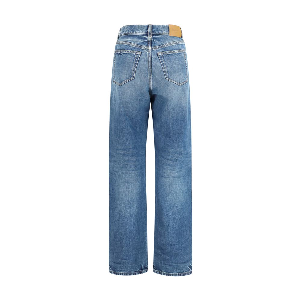 Elevate your wardrobe with the Saint Laurent Blue Cotton Relaxed Fit Jeans, crafted from premium selvedge denim, embodying timeless sophistication and effortless allure.