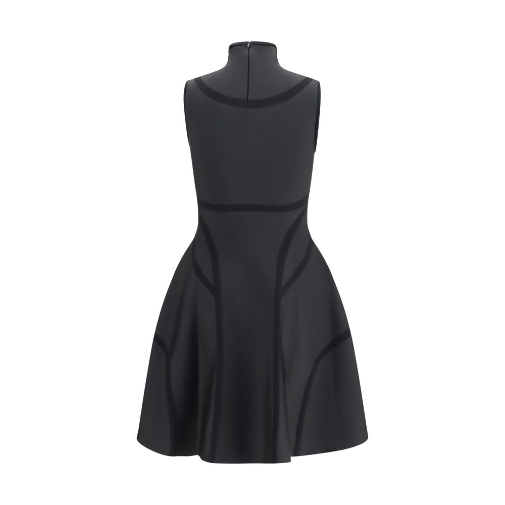 Discover the Alexander McQueen Black Polyester Cocktail Dress, a masterpiece of fitted elegance and anatomical artistry, perfect for those who embody luxury and sophistication.
