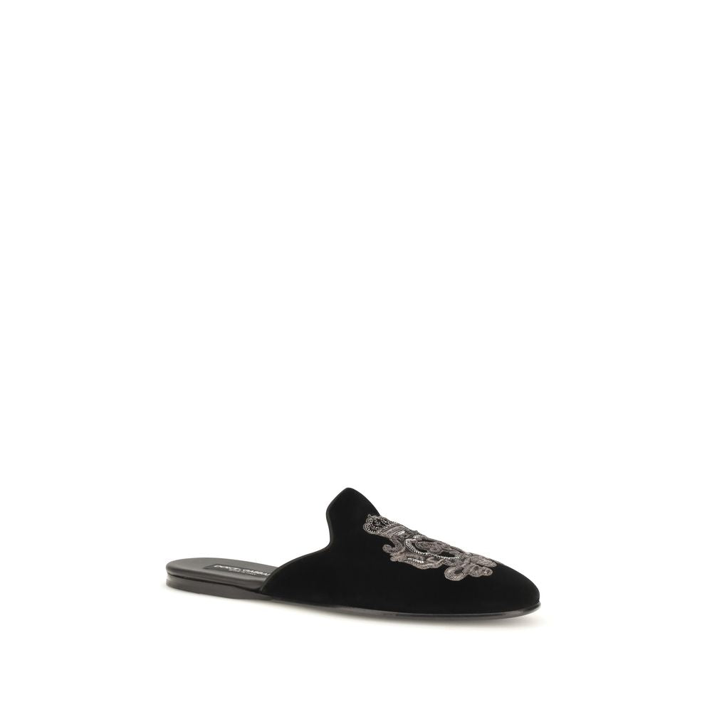 Indulge in the exquisite allure of Dolce & Gabbana's Black Velvet Flats from the Young Pope collection, where luxurious craftsmanship meets timeless elegance.