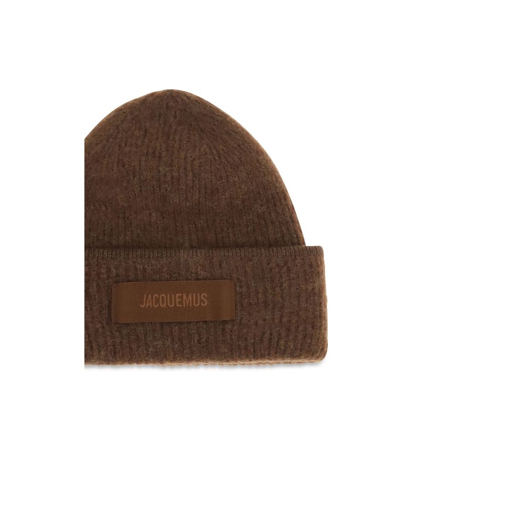 Indulge in the exquisite Jacquemus Brown Alpaca Vicugna Pacos Beanie, a harmonious blend of luxury and comfort, perfect for the discerning individual seeking timeless elegance.