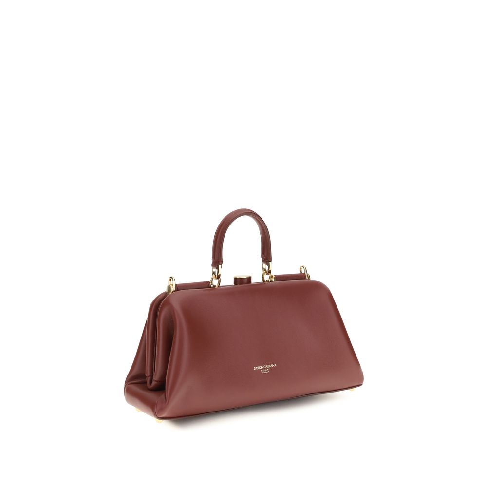 Discover the exquisite Dolce & Gabbana Red Lamb Ovis Aries Handbag, a timeless blend of luxury and versatility, crafted for the discerning individual seeking elegance.