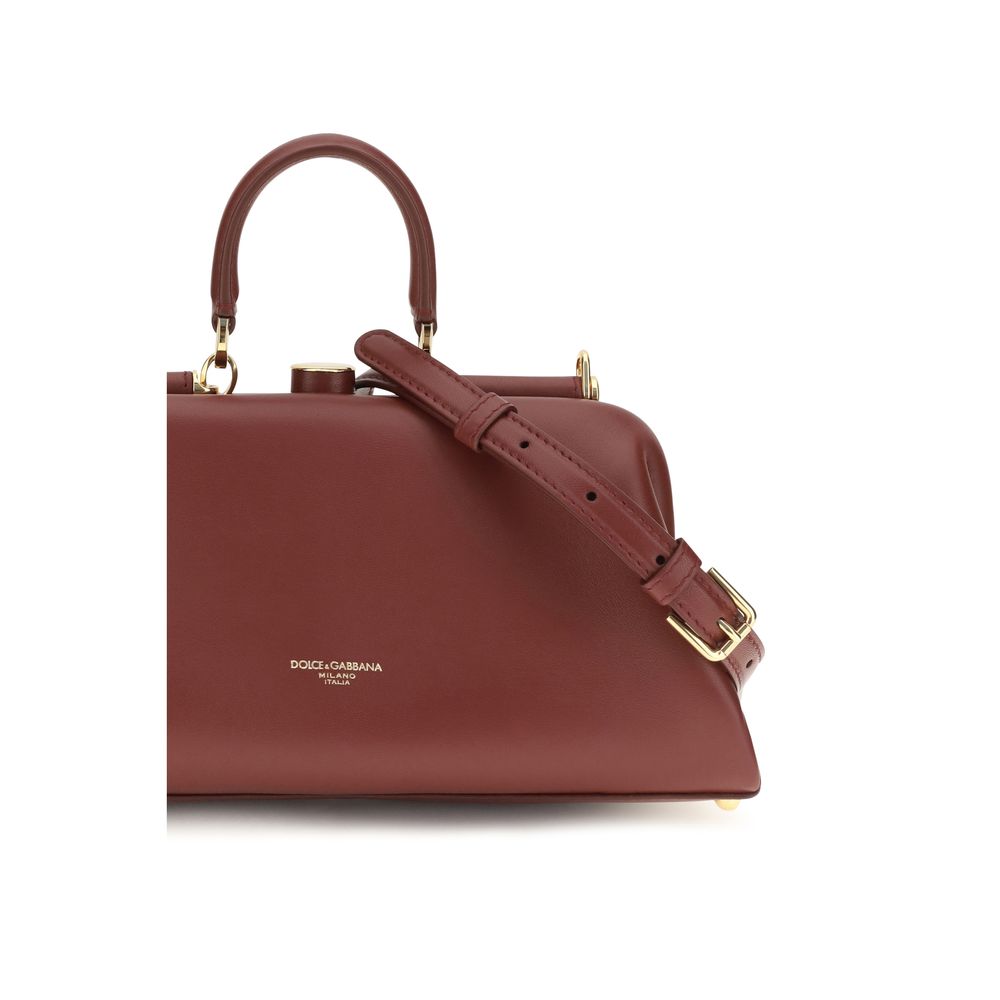Indulge in the exquisite craftsmanship of the Dolce & Gabbana Red Lamb Ovis Aries Handbag, a timeless accessory that embodies luxury and sophistication for every occasion.