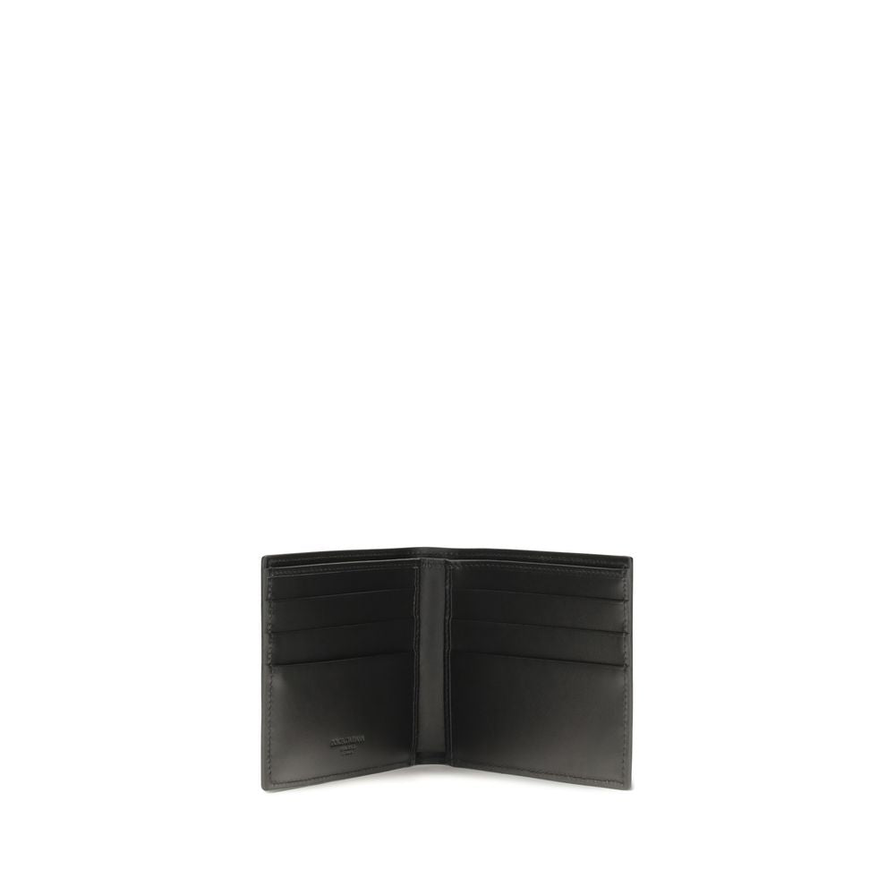 Indulge in the exquisite craftsmanship of the Dolce & Gabbana Black Calf Leather Bos Taurus Wallet, a timeless accessory that embodies luxury and sophistication for discerning tastes.