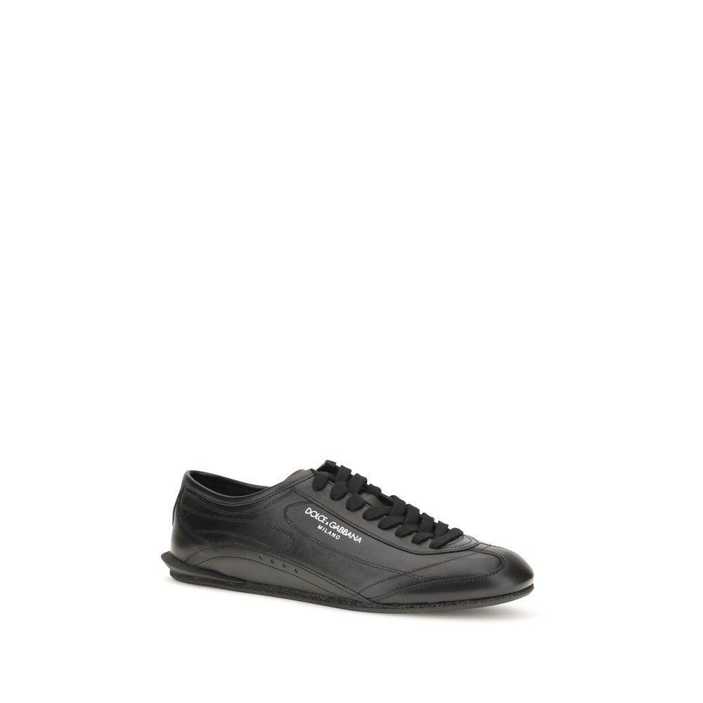 Discover the exquisite craftsmanship of Dolce & Gabbana's Black Calf Leather Bos Taurus Low Top Sneakers, a symbol of refined luxury for the discerning individual.
