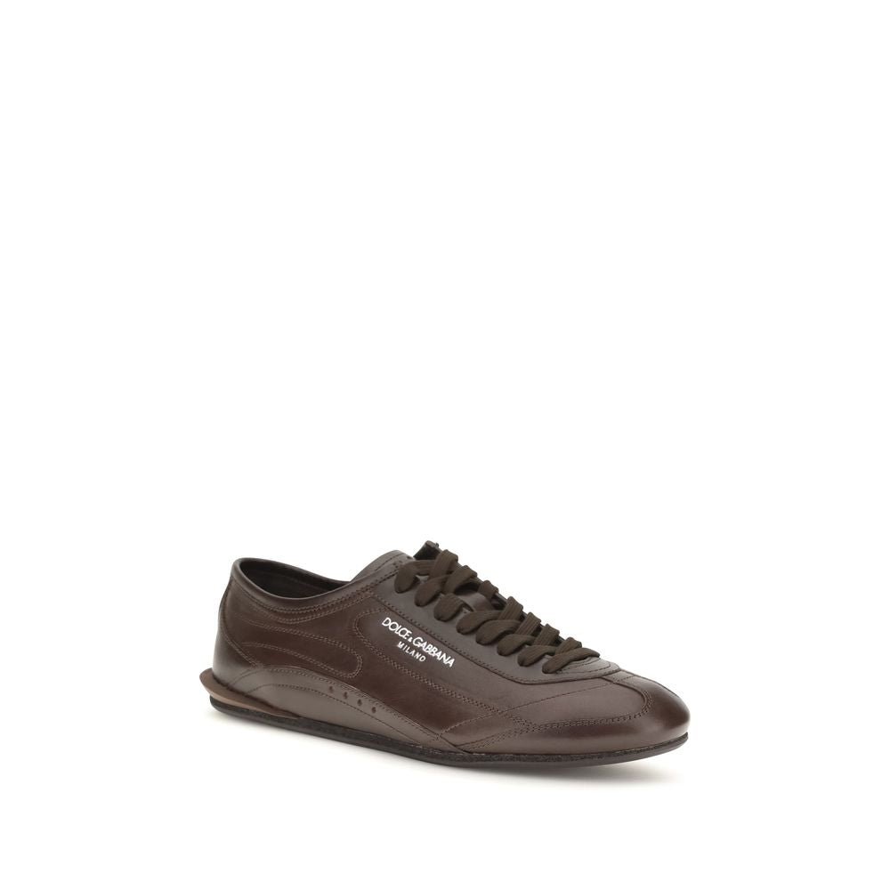Indulge in the exquisite craftsmanship of Dolce & Gabbana's Brown Calf Leather Bos Taurus Low Top Sneakers, where refined elegance meets luxurious comfort, perfect for the discerning individual.