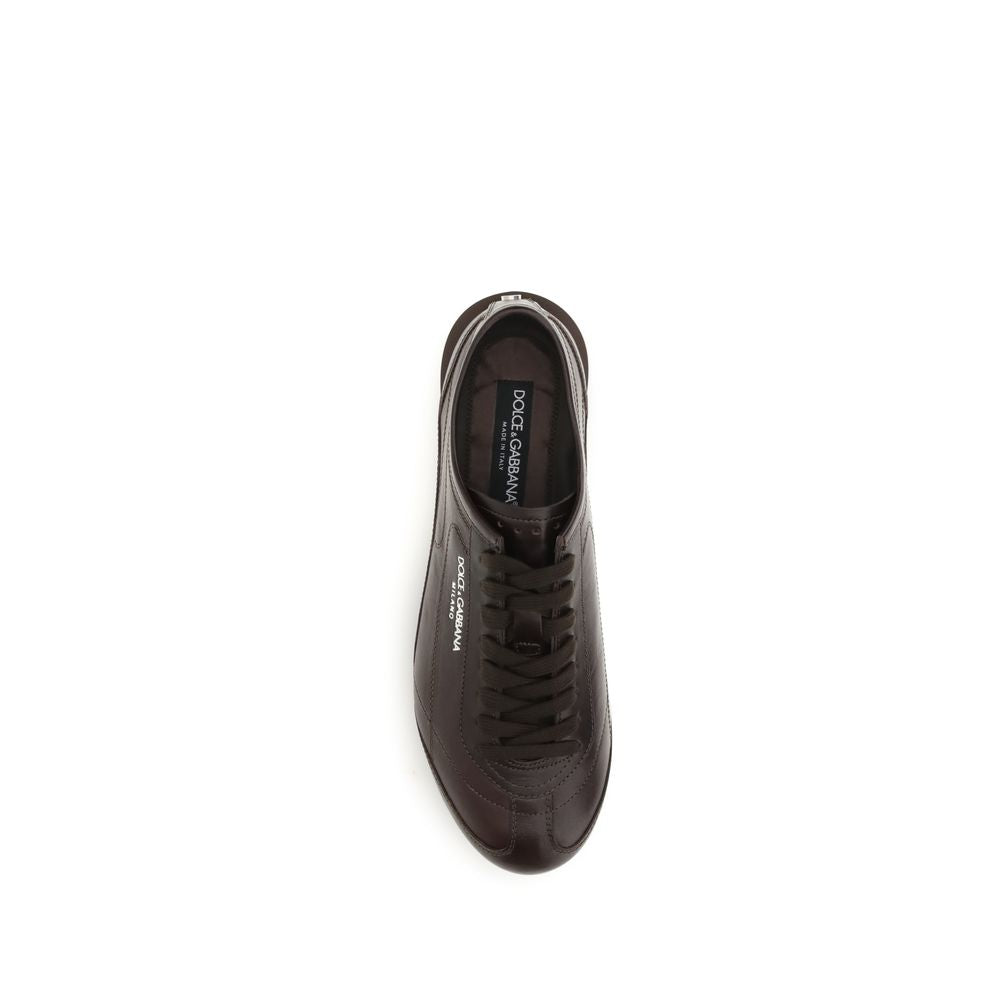 Indulge in the exquisite craftsmanship of Dolce & Gabbana's Brown Calf Leather Bos Taurus Low Top Sneakers, where luxury meets refined elegance for the discerning individual.