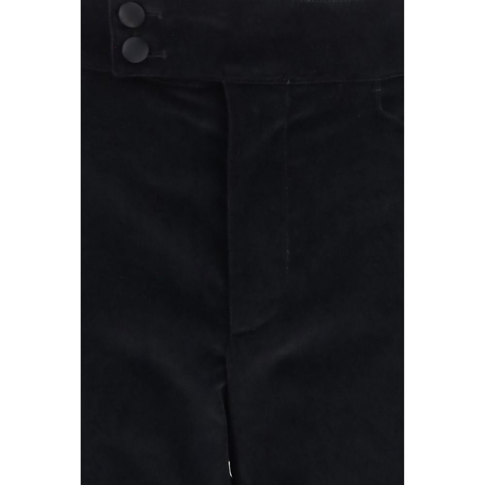 Indulge in the refined elegance of Dolce & Gabbana's Black Cotton Casual Pants, crafted from luxurious velvet for a timeless silhouette that embodies sophistication and style.