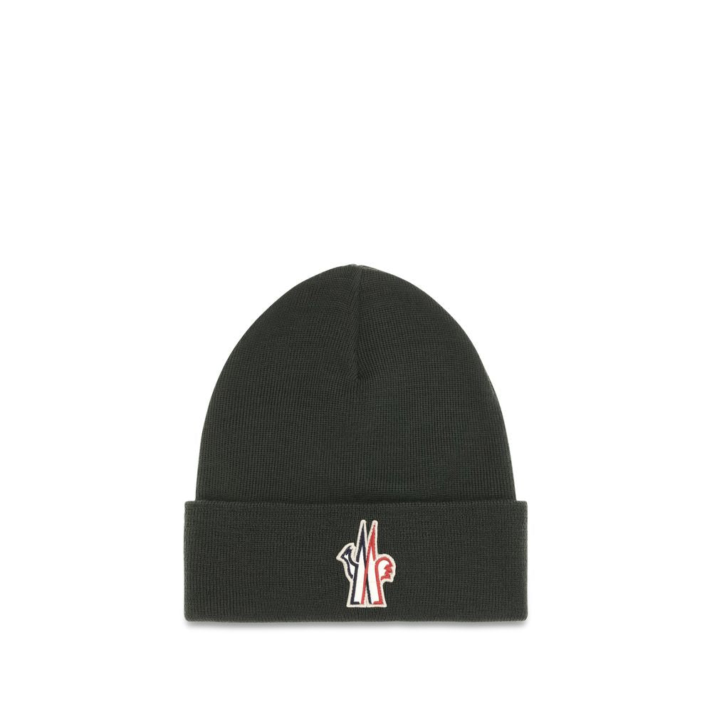 Indulge in the Moncler Grenoble Bicolor Wool Oves Aries Beanie, a luxurious blend of soft virgin wool and exquisite craftsmanship, perfect for elevating your cold-weather style.