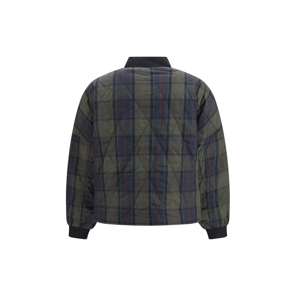 Indulge in the exquisite craftsmanship of the Barbour Black Polyester Bomber, a reversible quilted masterpiece that embodies luxury and versatility for the discerning individual.