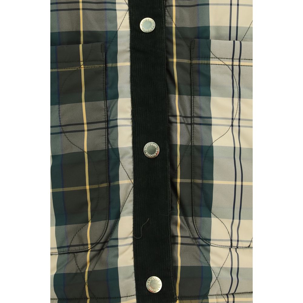 Discover the Barbour Bicolor Polyester Shell Jacket, a reversible masterpiece that embodies elegance with its quilted design and velvet trims, perfect for the discerning individual.