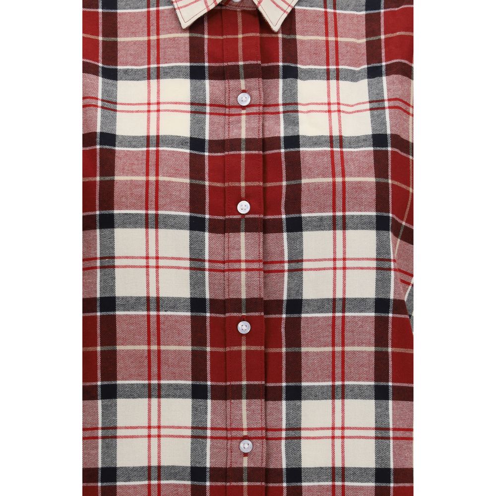 Indulge in the exquisite craftsmanship of the Barbour Red Cotton Pattern Shirt, a timeless piece that embodies luxury and sophistication for the discerning individual.