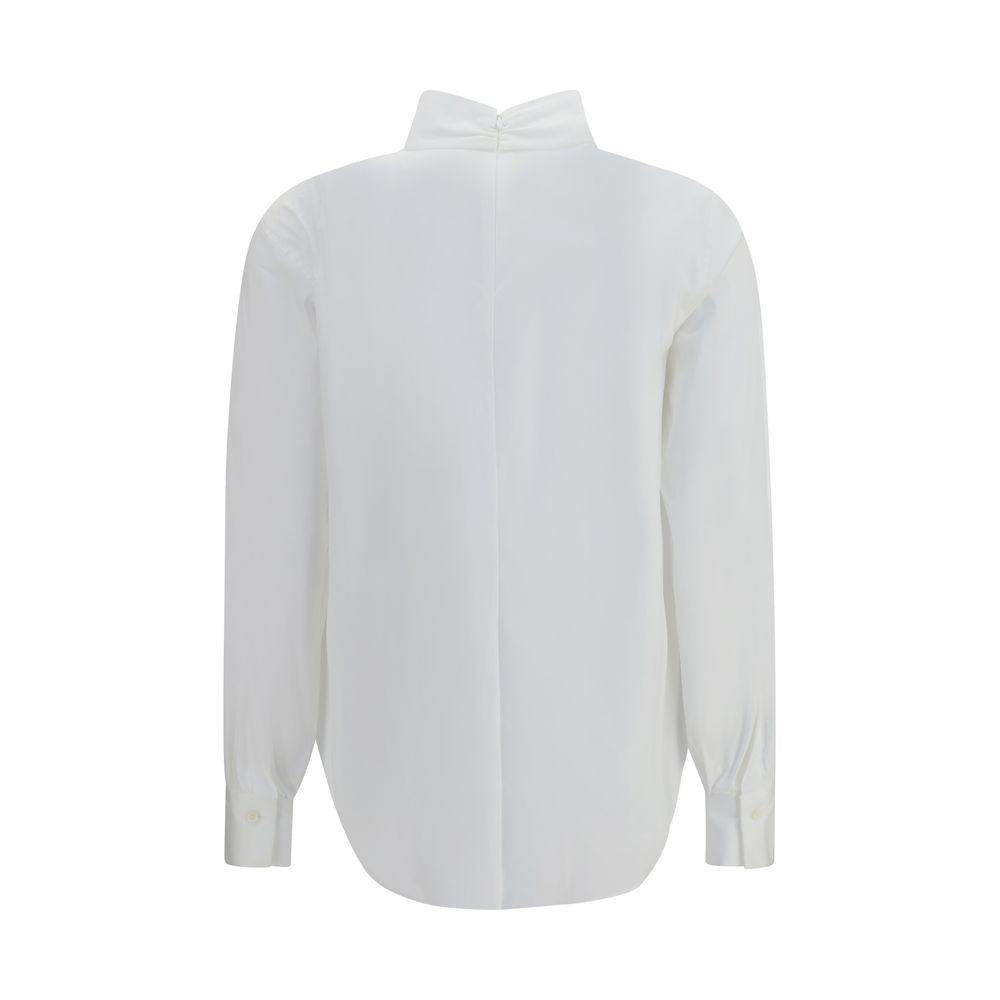 Elevate your wardrobe with the Brunello Cucinelli White Cotton Blouse, a masterpiece of refined craftsmanship and luxurious detail, perfect for the discerning individual.