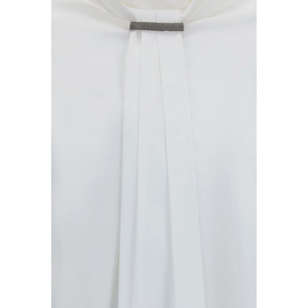 Elevate your wardrobe with the Brunello Cucinelli White Cotton Blouse, a masterpiece of pleated elegance and refined craftsmanship, perfect for the discerning individual.