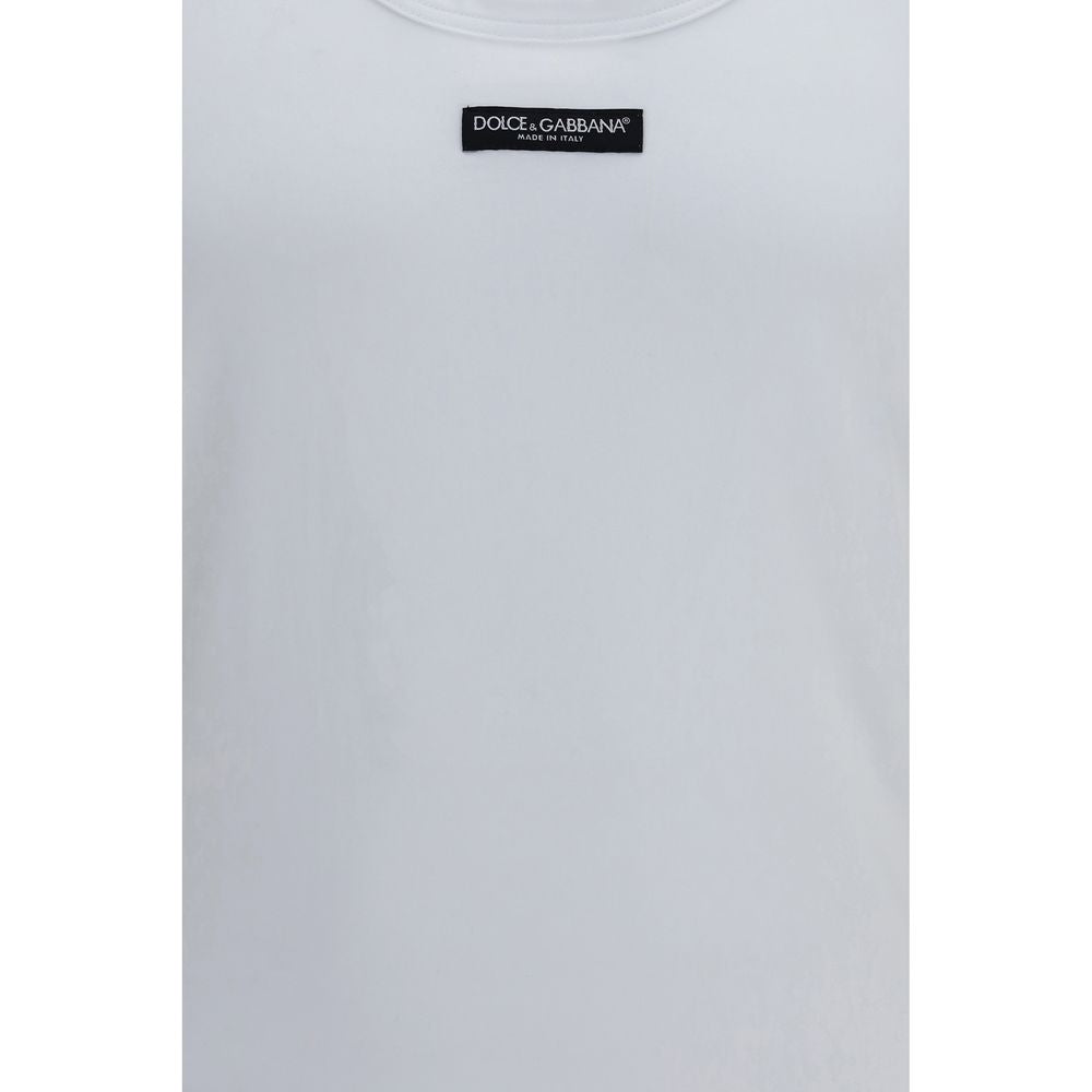 Elevate your wardrobe with the Dolce & Gabbana White Cotton Top, a masterpiece of soft stretch cotton that embodies effortless luxury and timeless elegance.