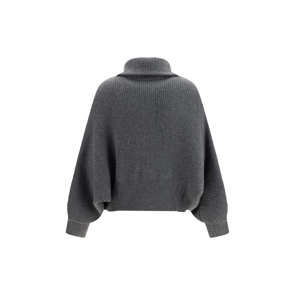 Indulge in the exquisite allure of the Brunello Cucinelli Gray Cashmere Cardigan, a masterpiece of luxurious craftsmanship that envelops you in refined elegance.