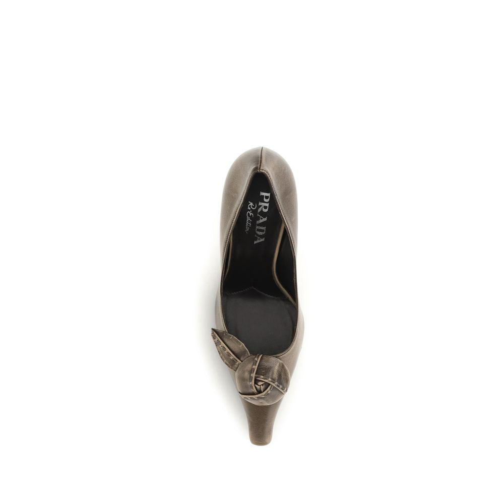 Indulge in the exquisite elegance of Prada Beige Goatskin High Heel Pumps, a timeless masterpiece crafted for those who embody luxury and sophistication.
