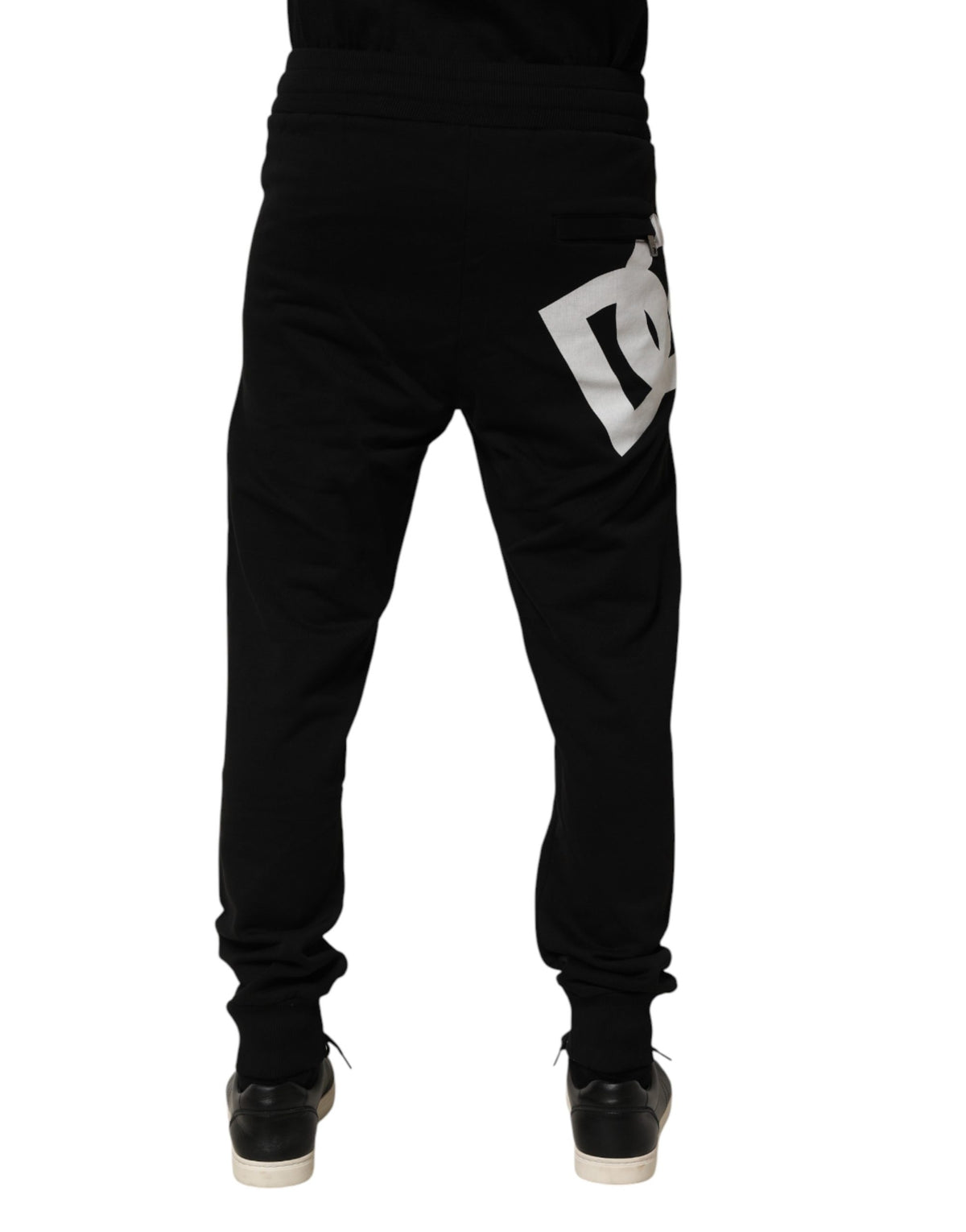 Indulge in the exquisite craftsmanship of Dolce & Gabbana's black cotton jogger pants, a luxurious statement of style and sophistication for the discerning individual.