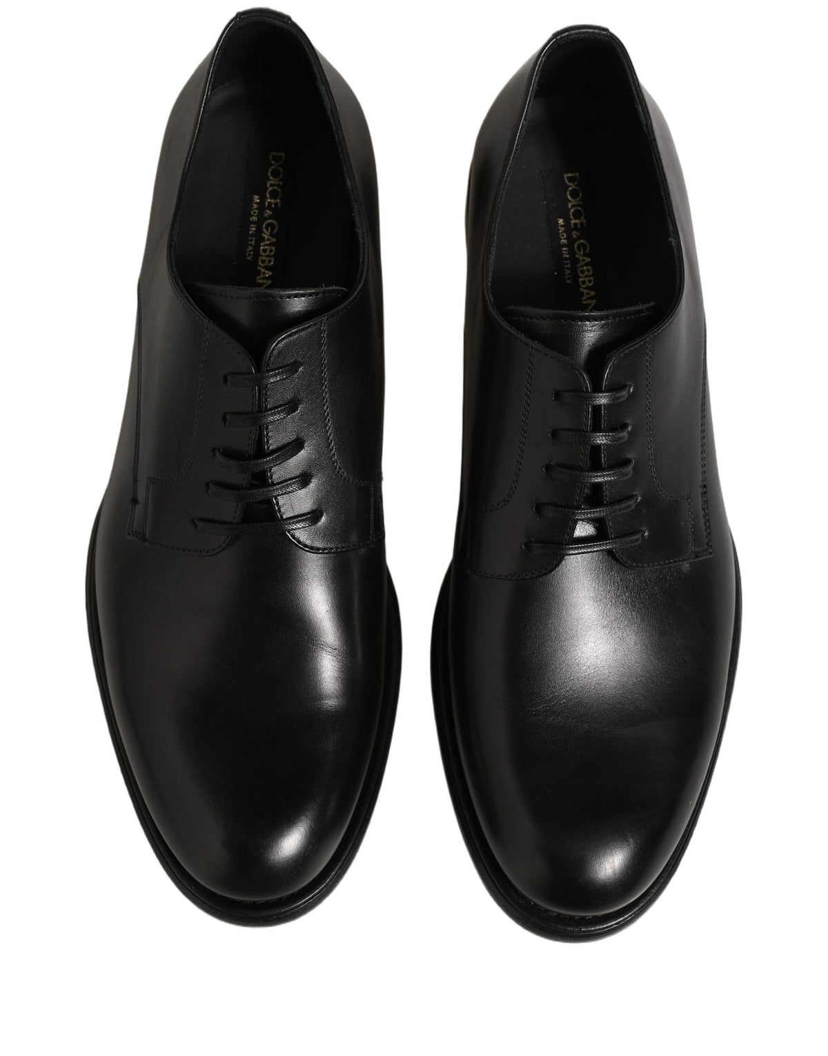Indulge in the exquisite craftsmanship of Dolce & Gabbana Black Calfskin Leather Derby shoes, where timeless elegance meets modern sophistication for the discerning individual.