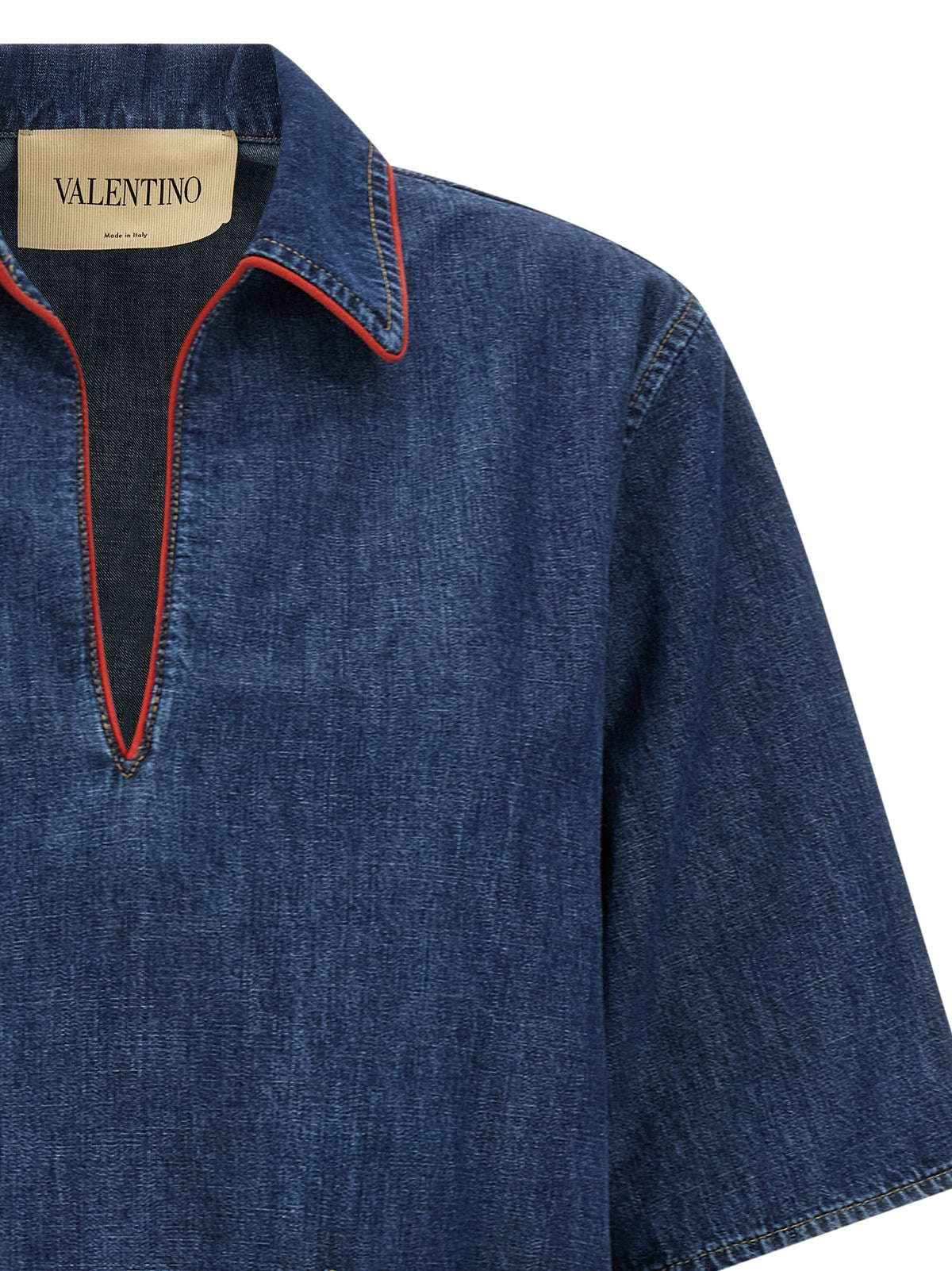 Discover the Valentino Garavani Blue Cotton Blouse, a timeless piece of Italian craftsmanship that elevates your wardrobe with its elegant design and luxurious comfort.