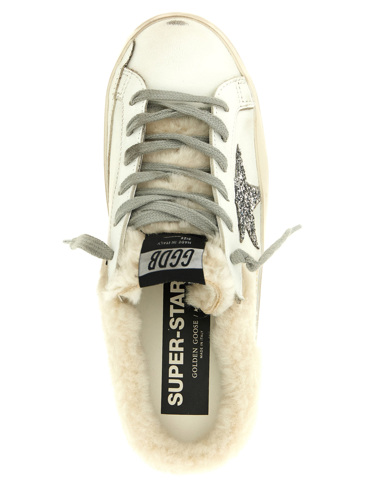 Elevate your style with Golden Goose White Leather Slides, where luxurious leather meets plush shearling, embodying effortless sophistication for the discerning individual.