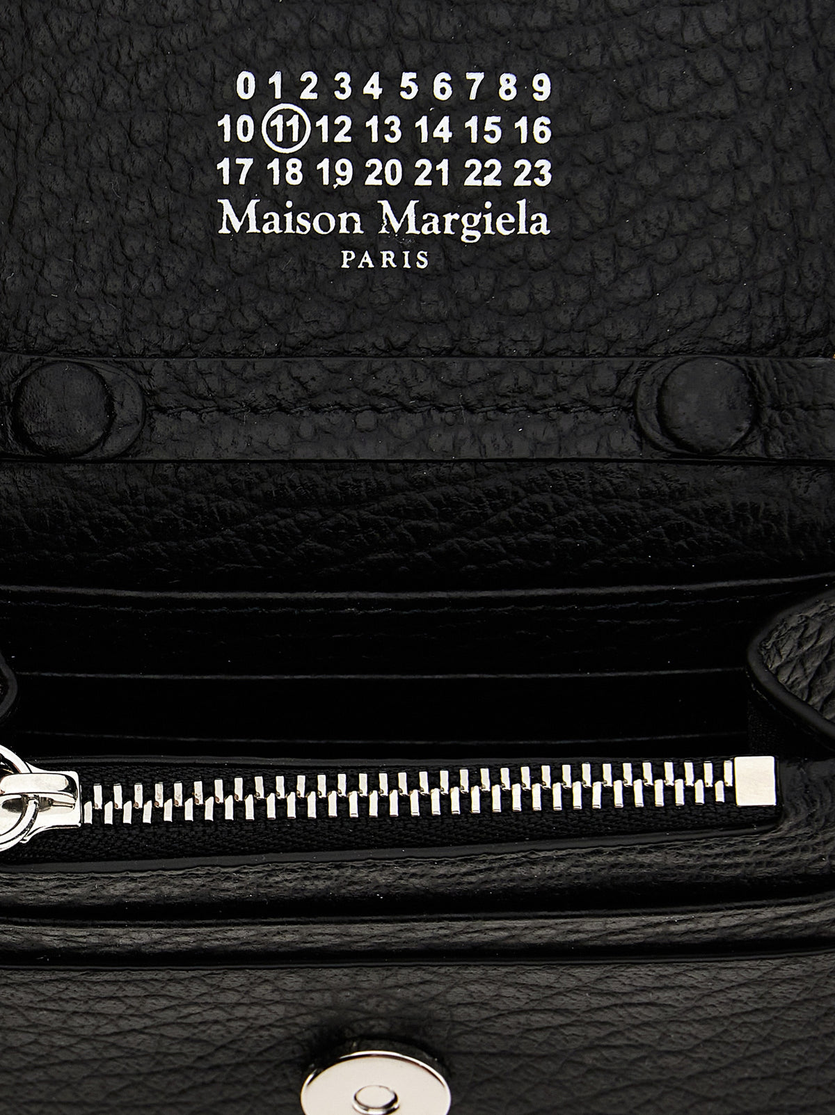 Discover the Maison Margiela Black Calfskin Cardholder, a masterpiece of exquisite craftsmanship in luxurious calfskin leather, perfect for the discerning individual.