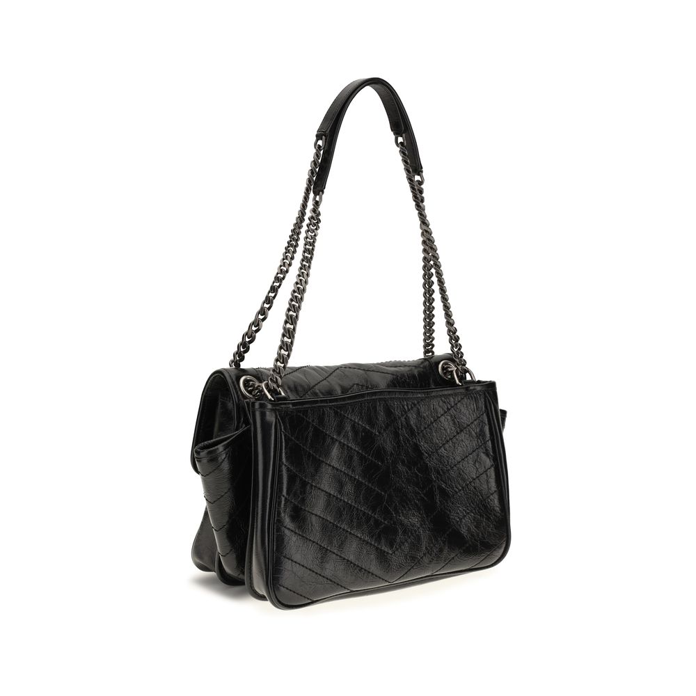 Experience the allure of the Saint Laurent Niki Tripouch Shoulder Bag, crafted from exquisite calf leather, embodying timeless elegance and versatile sophistication for the discerning individual.