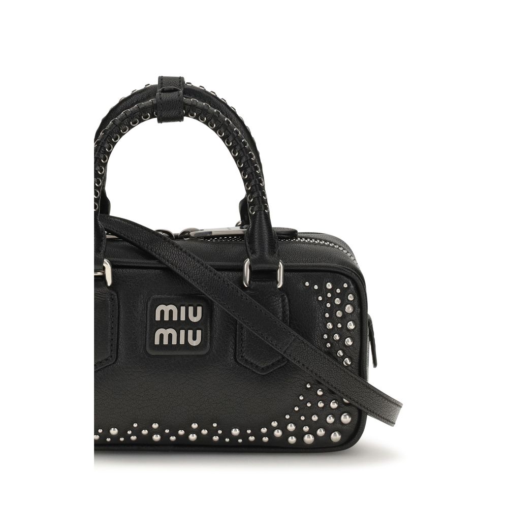Discover the Miu Miu Black Calf Leather Bos Taurus Shoulder Bag, a masterpiece of exquisite craftsmanship adorned with polished studs, perfect for the discerning individual.