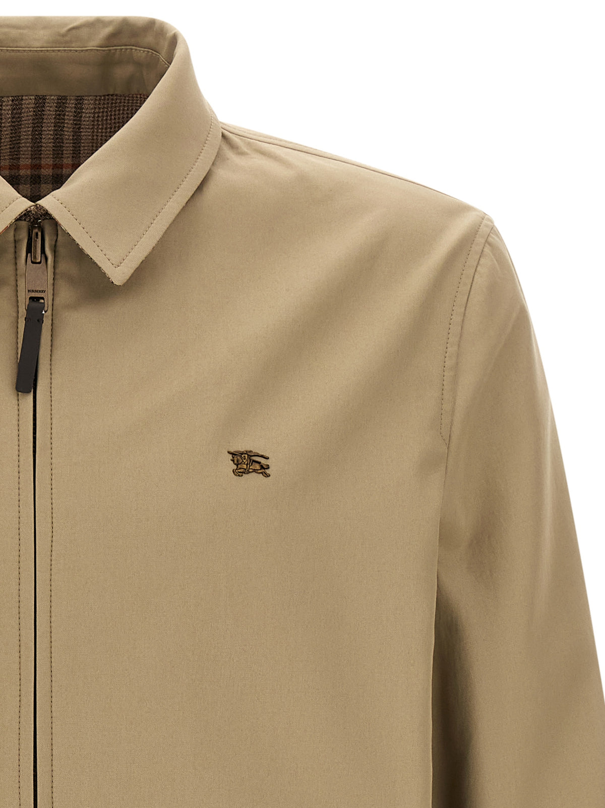 Discover the Burberry Beige Wool Full-Length Jacket, a masterpiece of craftsmanship in sumptuous mouliné wool, seamlessly blending timeless elegance with modern versatility.