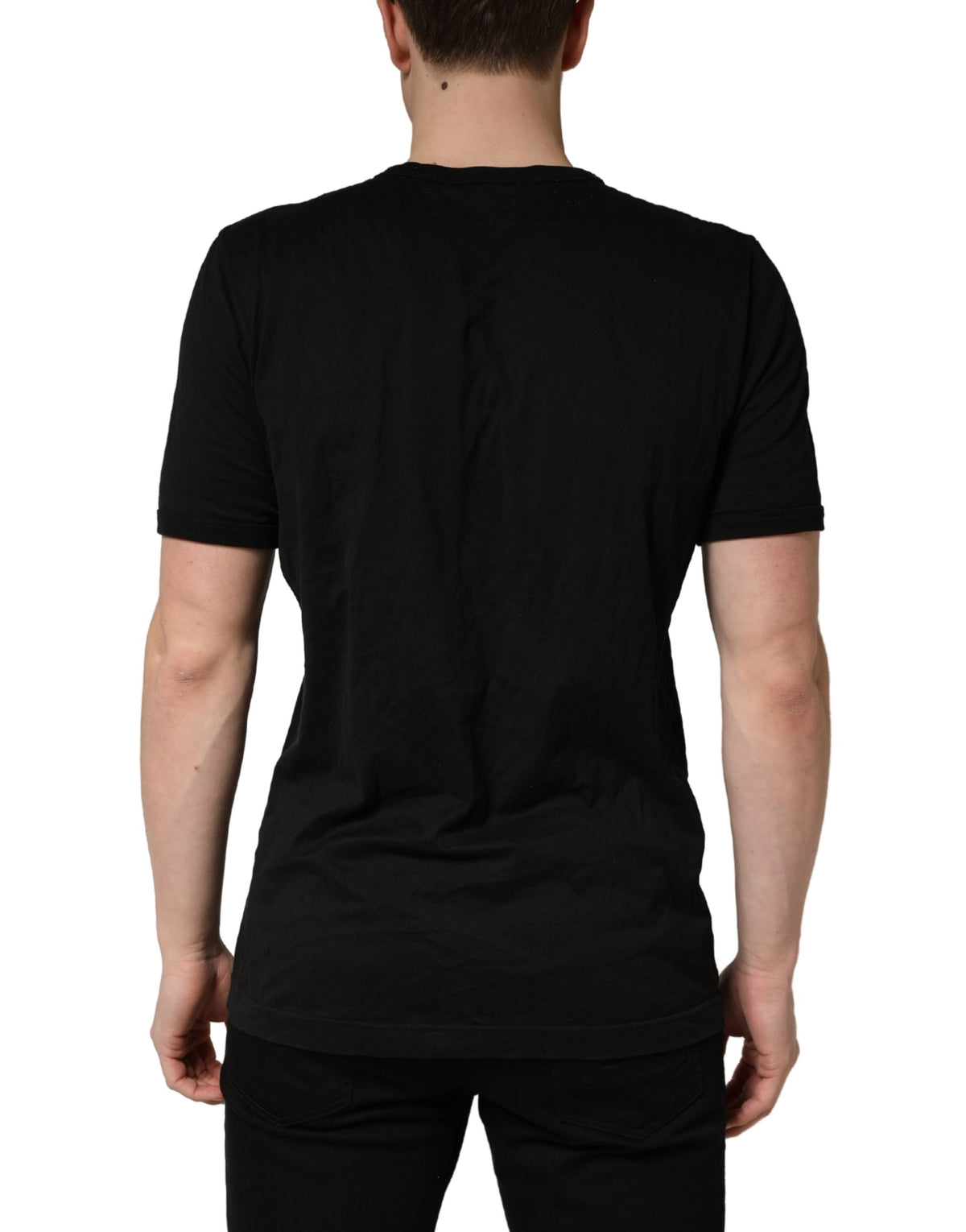 Indulge in the exquisite allure of the Dolce & Gabbana Black Sacred Heart Cotton Crew Neck T-shirt, a timeless piece crafted from luxurious cotton, embodying elegance and sophistication.