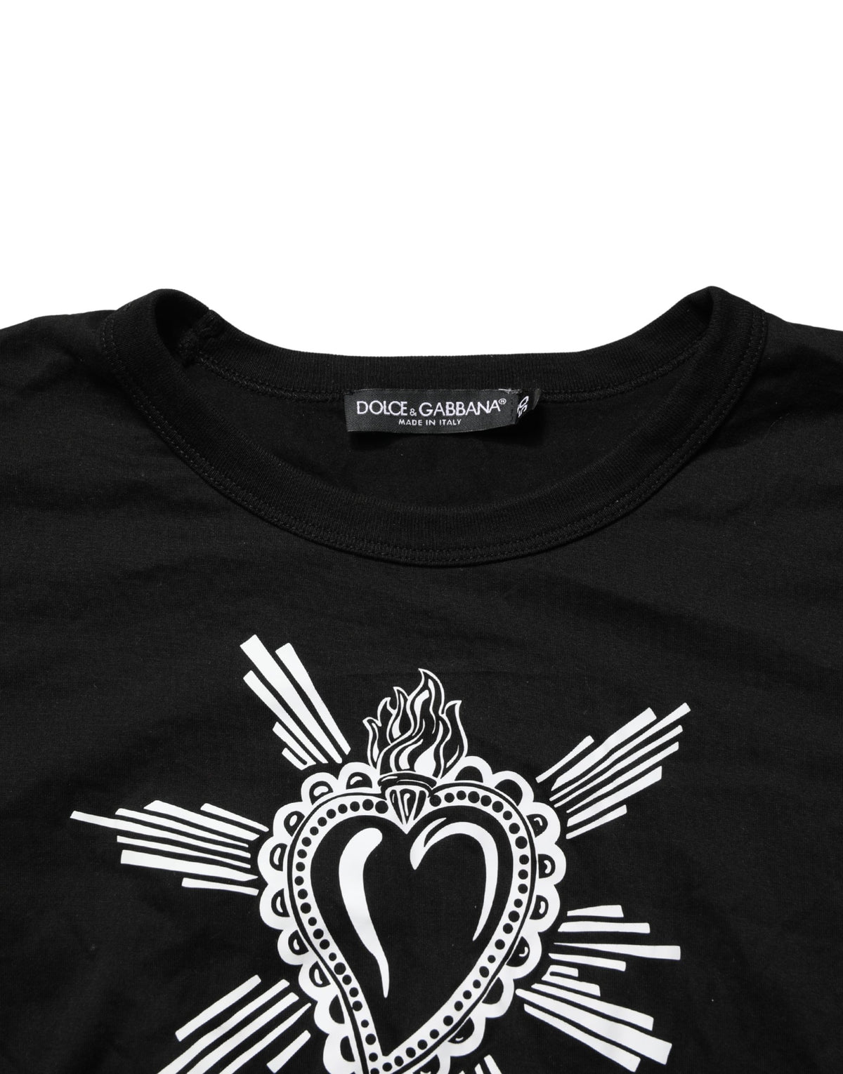 Indulge in the allure of Dolce & Gabbana's Black Sacred Heart T-shirt, a testament to Italian craftsmanship and timeless elegance, perfect for the discerning individual.