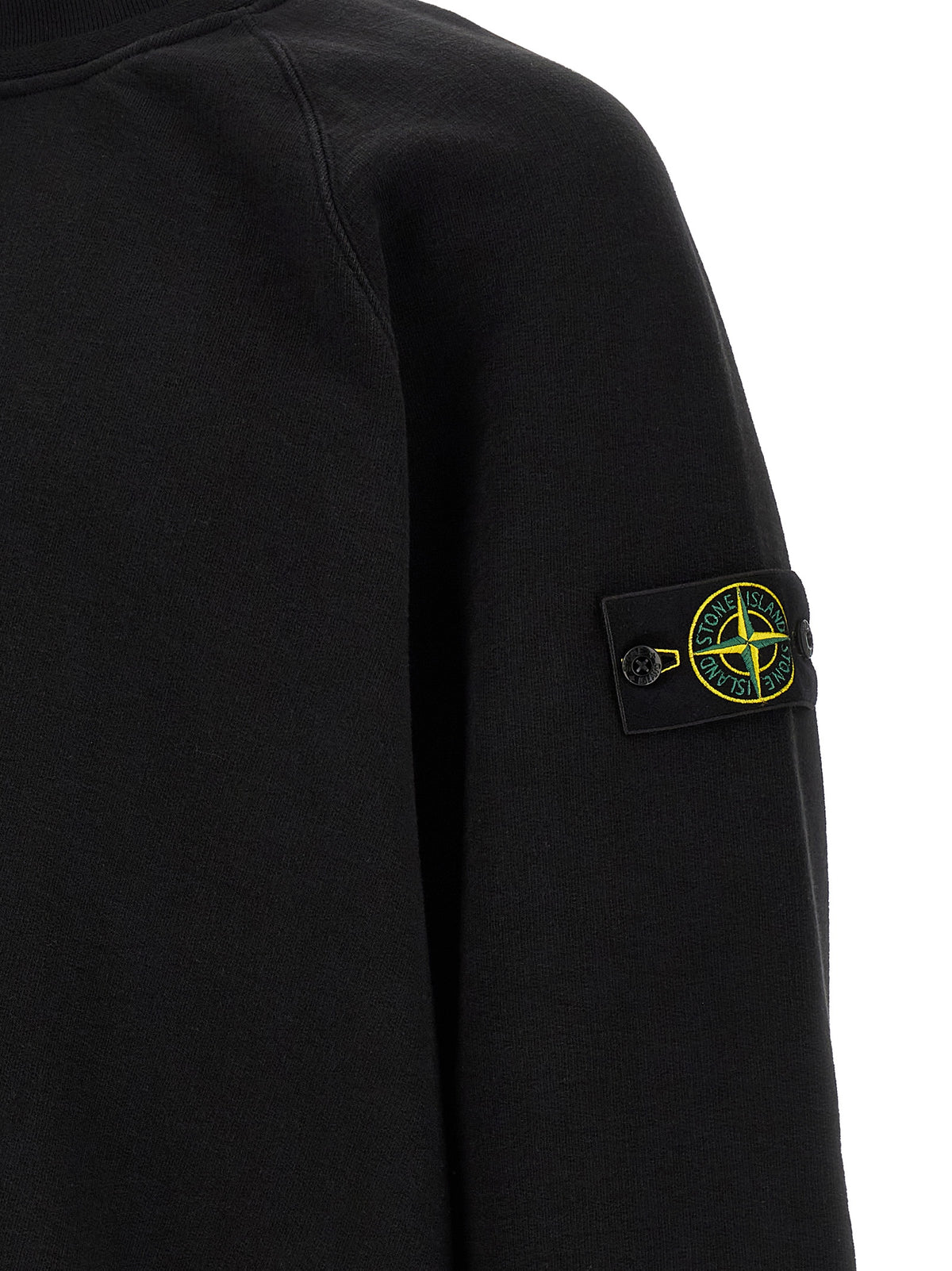 Indulge in the elegance of the Stone Island Black Cotton Sweatshirt, a timeless piece crafted from pure cotton, merging sophistication with cutting-edge design for the discerning individual.