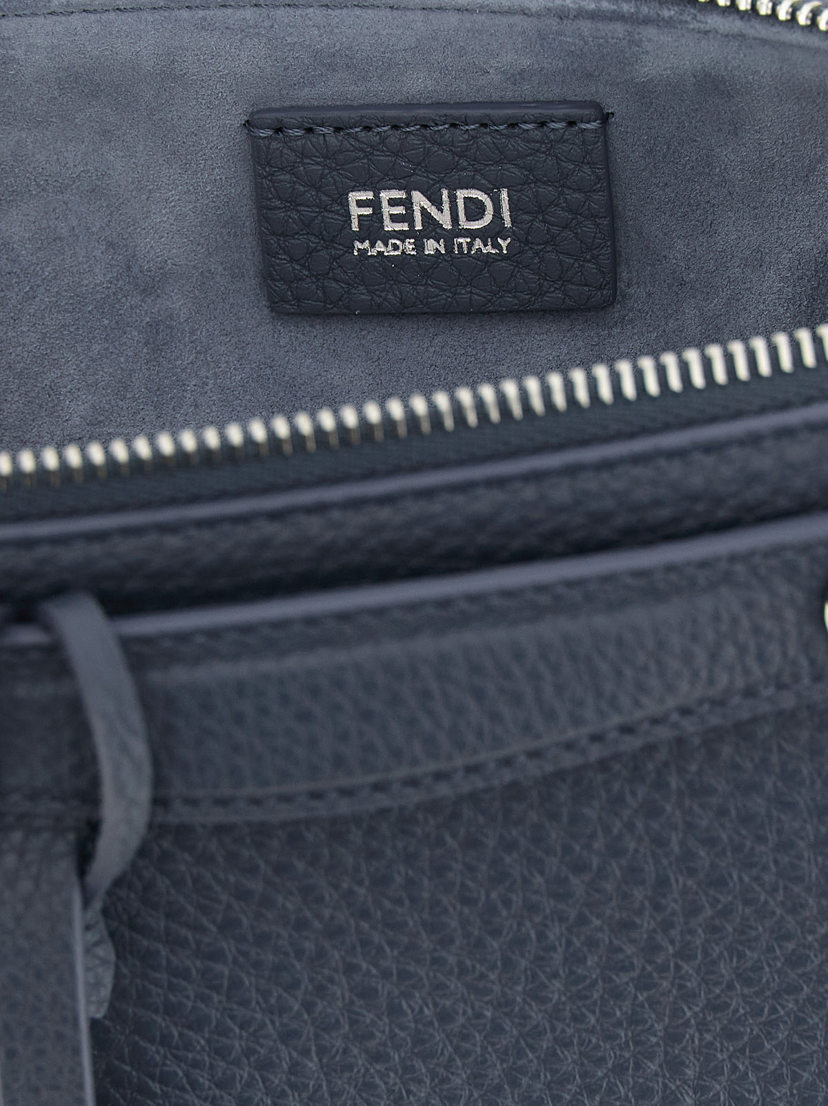 Indulge in the exquisite Fendi Blue Calfskin Clutch Bag, a masterpiece of Italian craftsmanship that embodies luxury and sophistication for the discerning connoisseur.