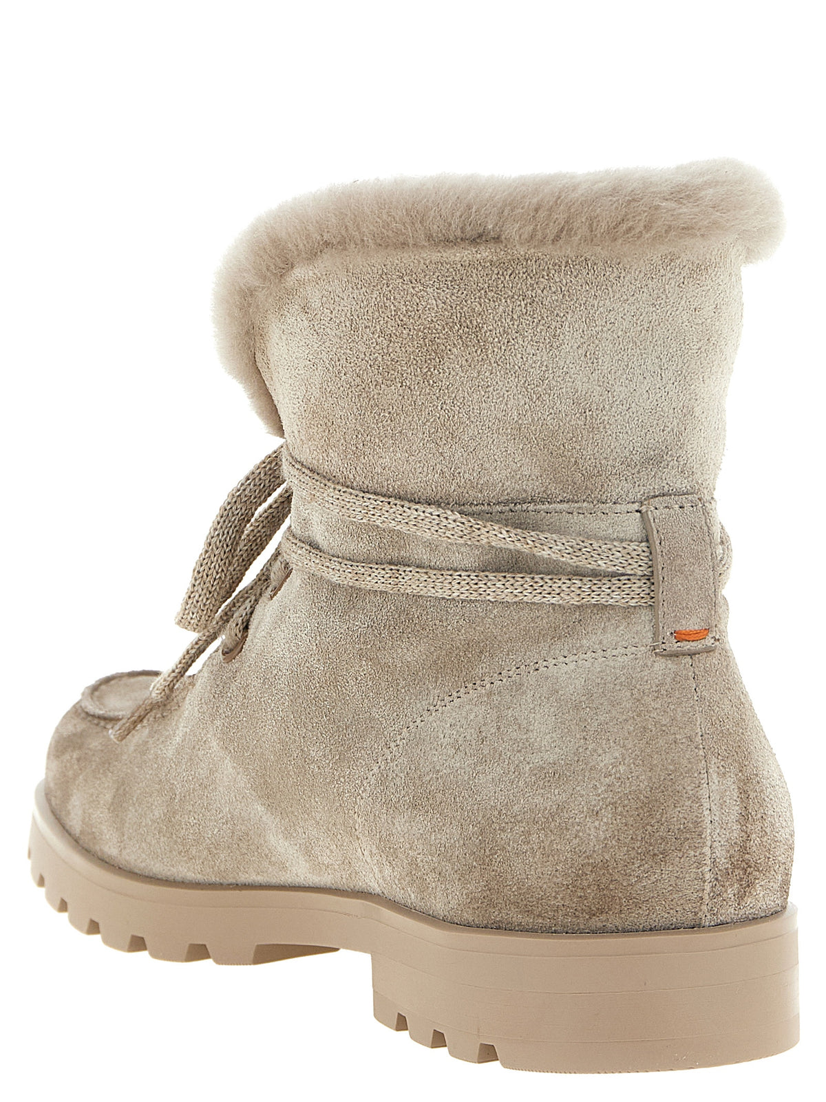 Indulge in the exquisite Santoni Beige Calfskin Ankle Boots, where fine suede meets luxurious shearling, embodying Italian artistry and timeless elegance for the discerning fashion connoisseur.
