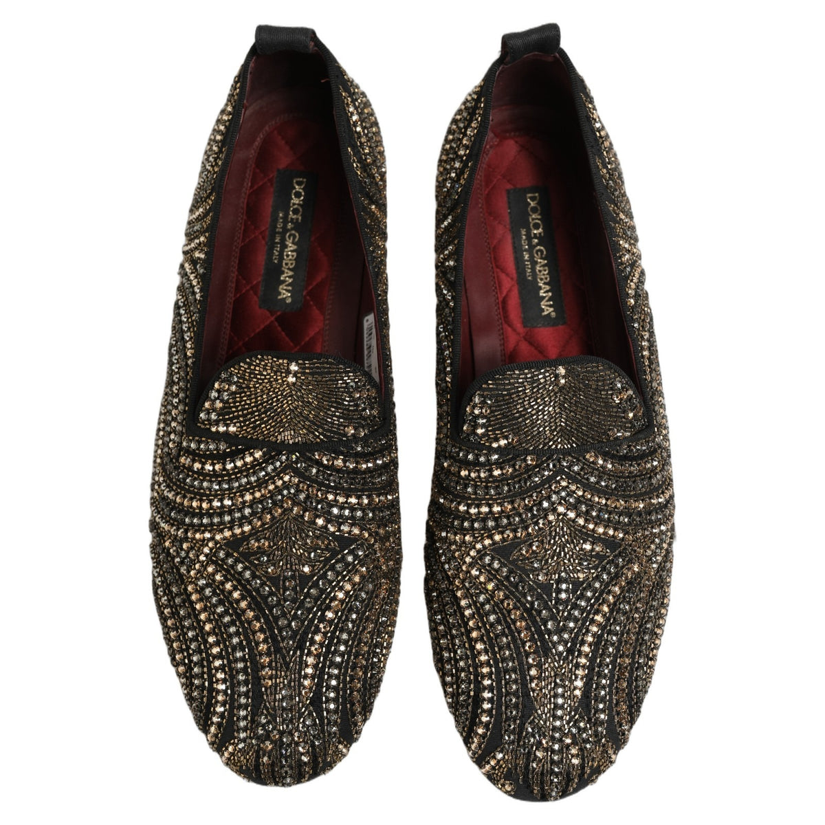 Indulge in the exquisite craftsmanship of Dolce & Gabbana's Black Gold Embellished Slippers, where luxurious leather meets intricate rhinestone details, embodying timeless elegance.