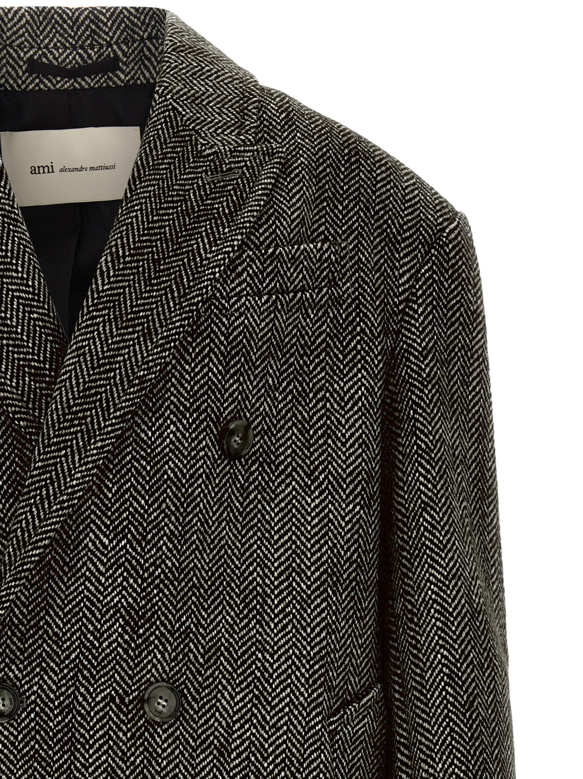 Experience the allure of AMI PARIS's Black Virgin Wool Coat, a timeless blend of artisanal craftsmanship and sophisticated design, perfect for the discerning wardrobe.