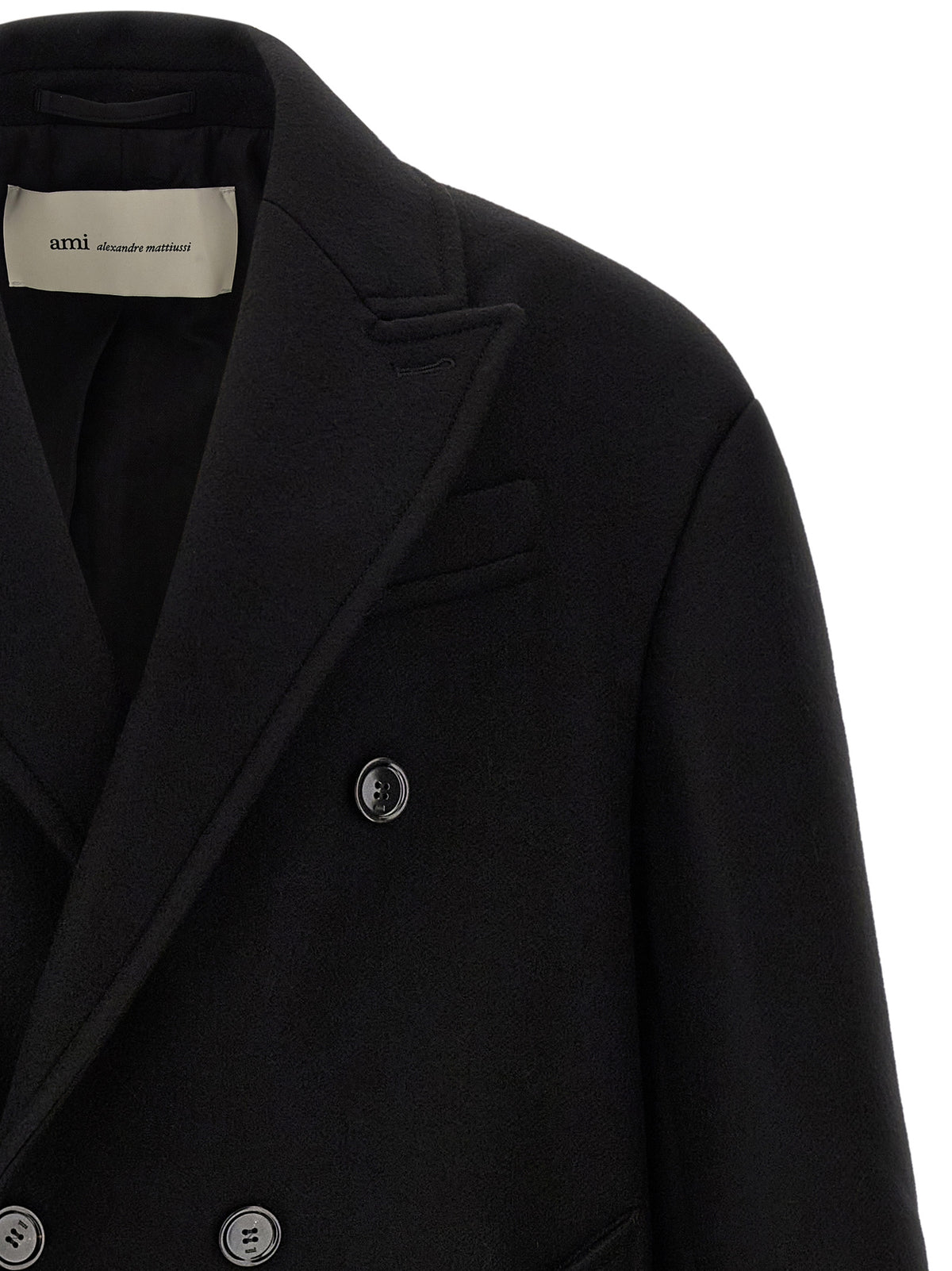 Embrace timeless elegance with the Ami Paris Black Wool Coat, crafted from luxurious boiled wool gabardine, redefining winter sophistication for the discerning individual.