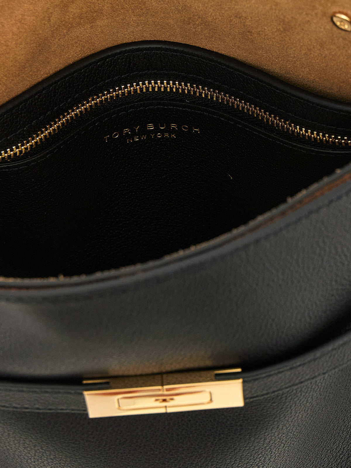 Discover the Tory Burch Black Lambskin Crossbody Bag, a masterpiece of craftsmanship in premium sheepskin leather, embodying elegance and sophistication for the discerning individual.
