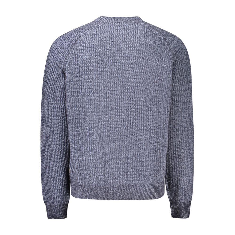 Indulge in the elegance of the Hugo Boss Blue Wool Sweatshirt, crafted with 40% recycled wool, embodying sophistication and timeless style for the discerning individual.