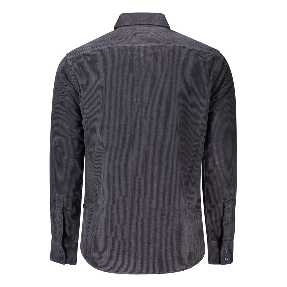 Indulge in the exquisite craftsmanship of the Hugo Boss Blue Cotton Shirt, a timeless piece that embodies luxury and sophistication for the discerning individual.