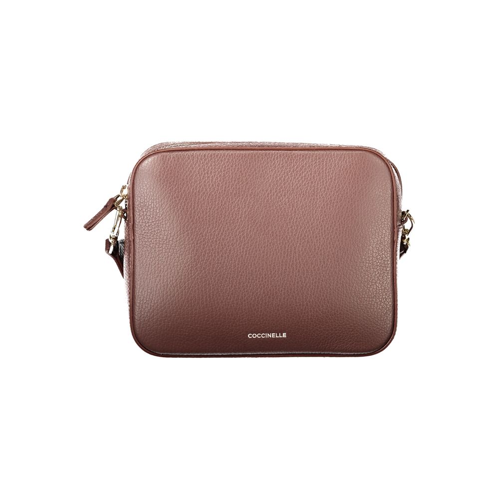 Indulge in the elegance of the Coccinelle Brown Leather Handbag, a masterpiece of design featuring adjustable straps and exquisite detailing, perfect for the discerning individual.