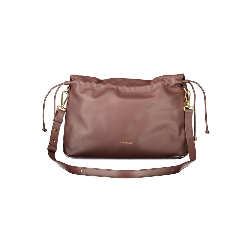Elevate your style with the Coccinelle Brown Leather Handbag, a masterpiece of craftsmanship featuring a drawstring closure and adjustable strap, perfect for the discerning individual.