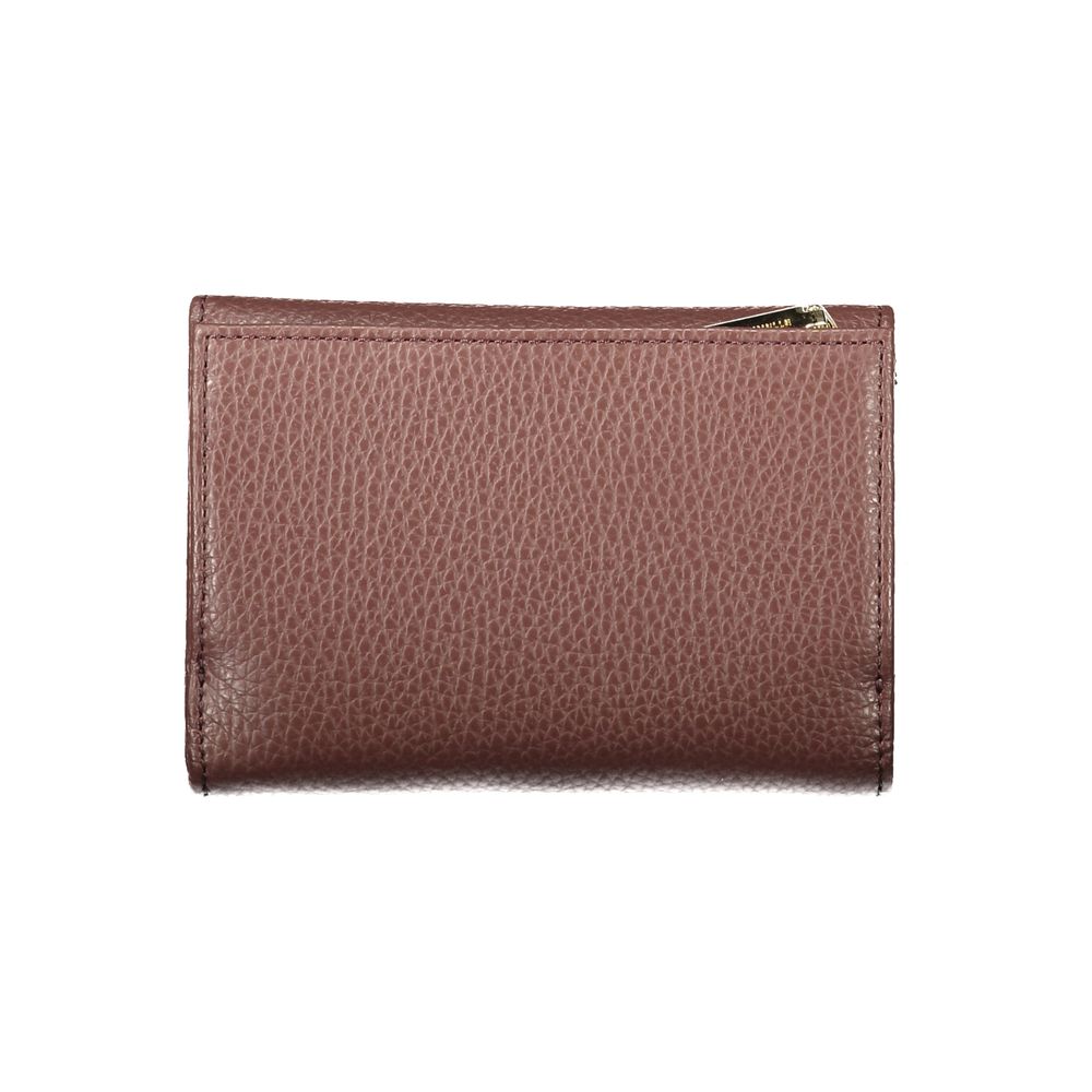 Indulge in the exquisite Coccinelle Brown Leather Wallet, a masterpiece of craftsmanship featuring a sleek design and luxurious functionality, perfect for the discerning individual.
