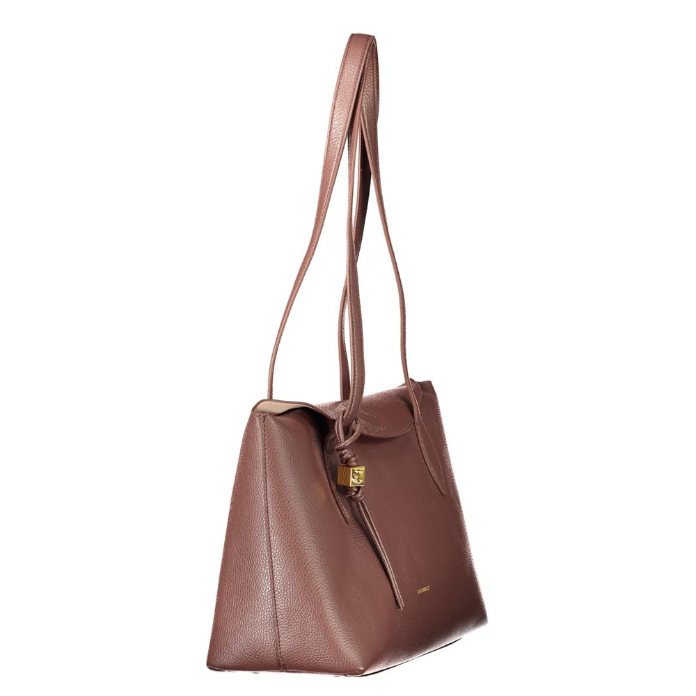 Indulge in the elegance of the Coccinelle Brown Leather Handbag, a masterpiece of design featuring exquisite craftsmanship and timeless allure, perfect for the discerning individual.